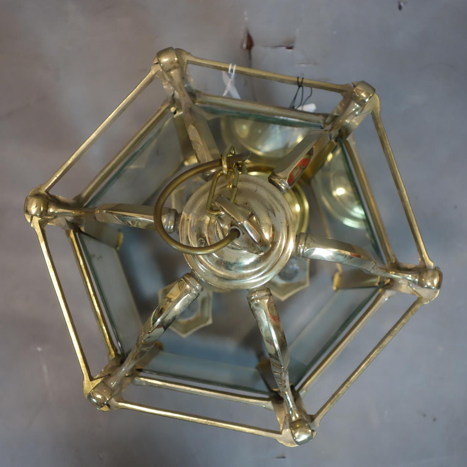 A heavy brass and glass hexagonal hanging ceiling lantern with bevelled glass panels, H.67 W.32 D. - Image 2 of 2