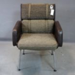 A mid 20th century armchair on splayed legs, H.90 W.69cm