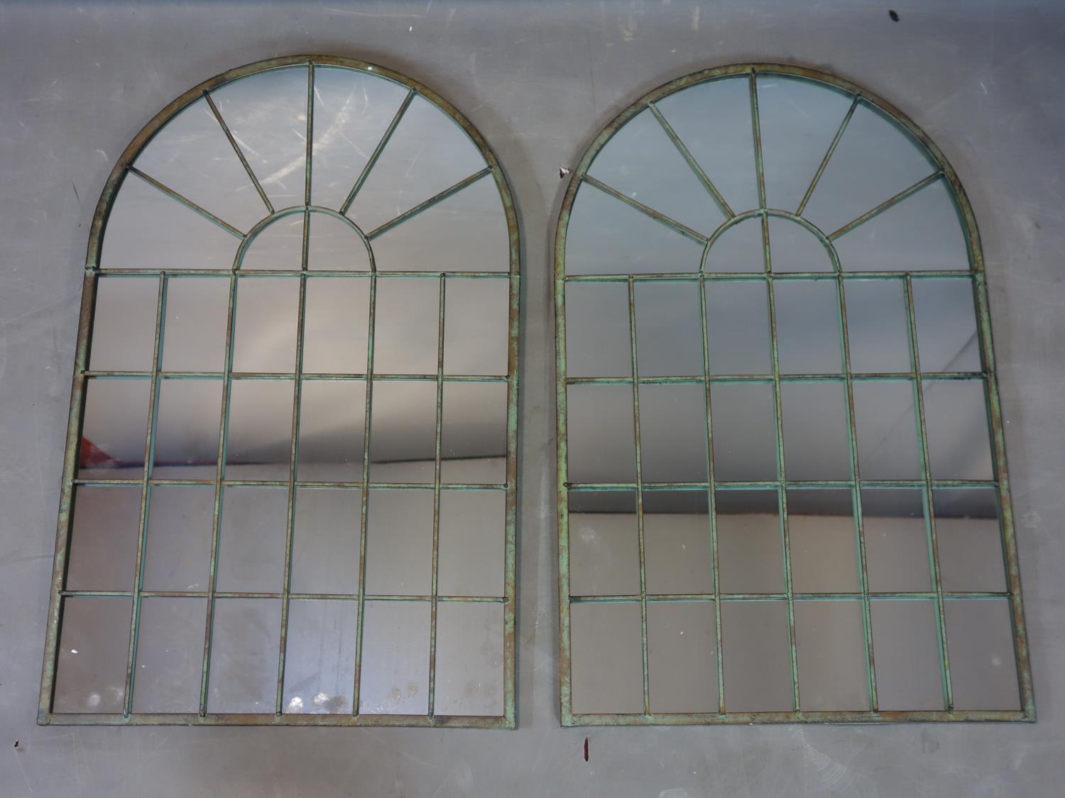 A pair of arched top garden mirrors, 78 x 49cm