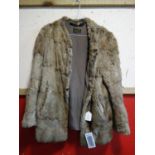 A ladies vintage rabbit fur coat, with label for Sherwins Furriers, Blackpool, H.70cm