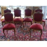 WITHDRAWN- A set of six mahogany French style chairs with rococo carved frames on cabriole supports.