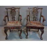 Two mahogany carver armchairs, with acanthus carved scroll arms, kelim upholstered seats, on