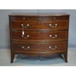 A 19th century inlaid mahogany bowfronted chest of drawers, with brush slide above three drawers, on