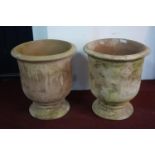 A pair of large fired clay planters, H.68cm Diameter 61cm (2)