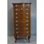 An early 20th century French mahogany pedestal chest of 8 drawers with mounted porcelain plaques,