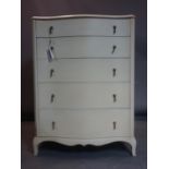 A mid 20th century cream painted serpentine chest of drawers, H.116 W.86 D.56cm