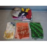 A large collection of ladies designer scarves and shawls