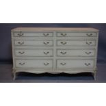 A 20th century French cream painted double chest of 8 drawers, H.84 W.139 D.50cm