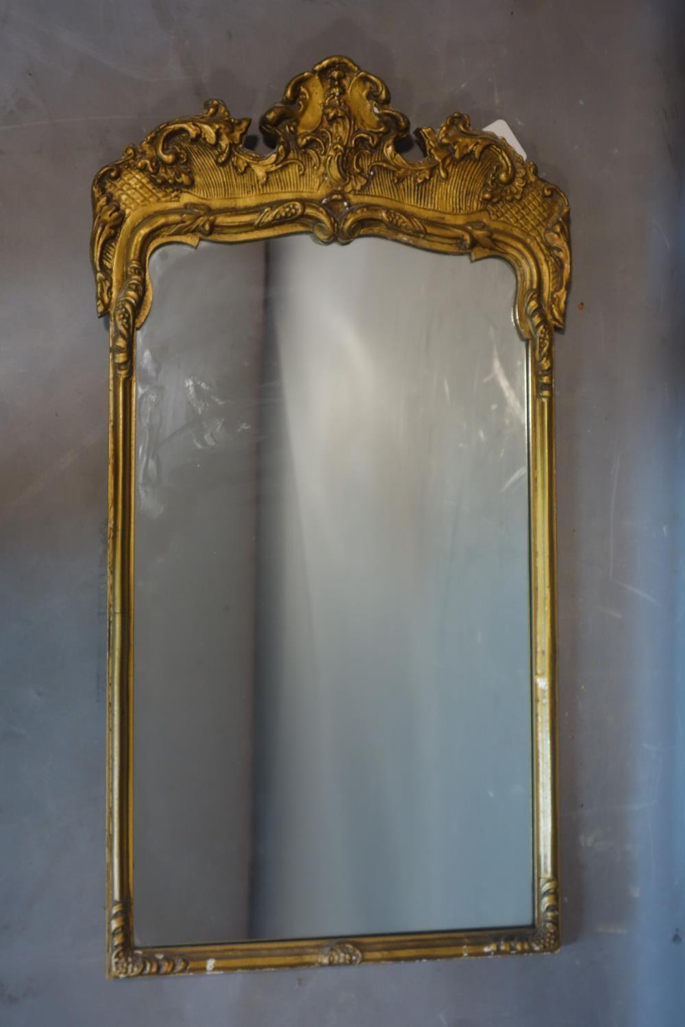 A Rococo style gilt wood and plaster pier mirror, 82 x 45cm