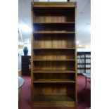 A tall oak bookcase, H.228 W.101 D.32cm