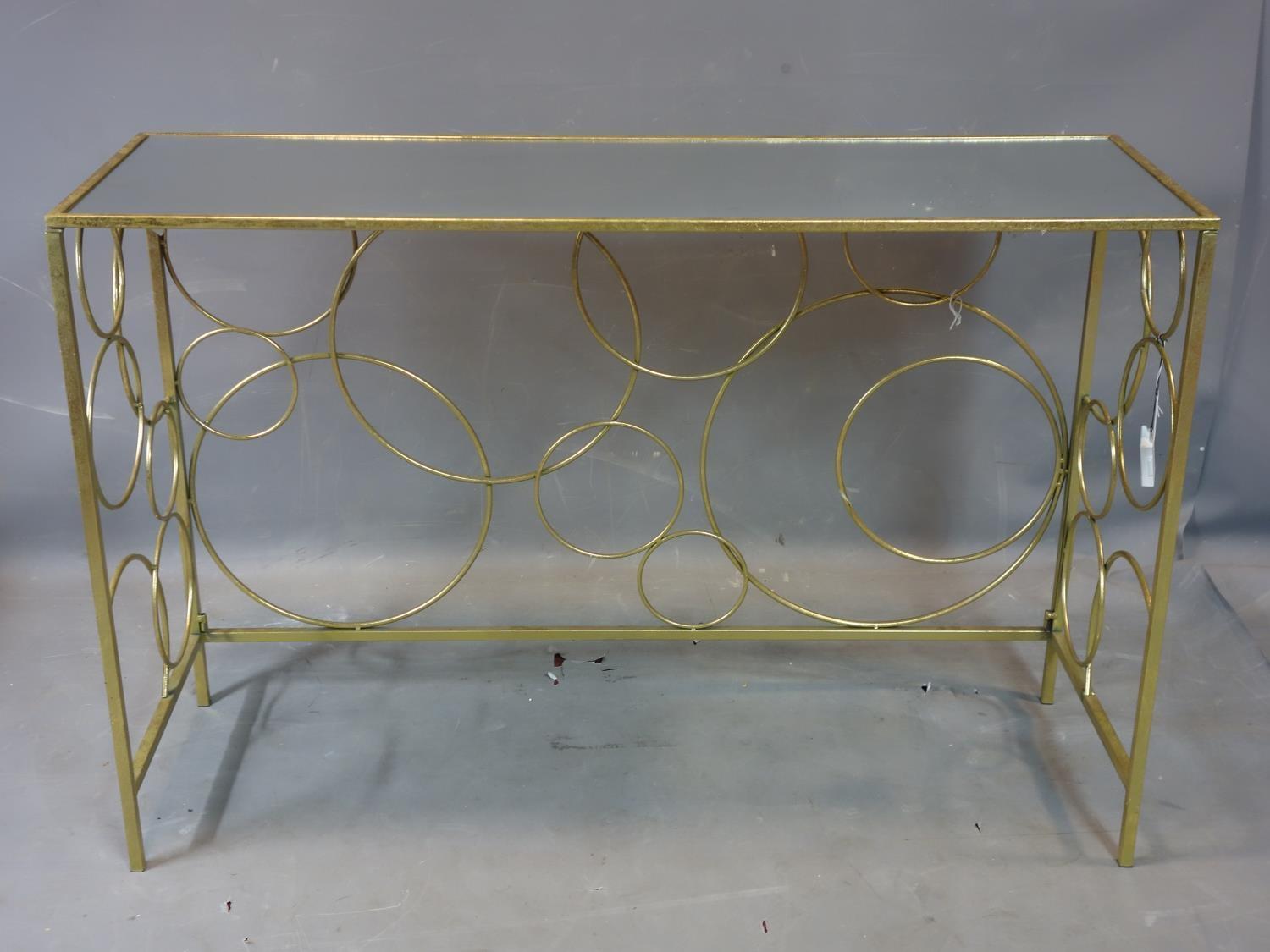 A contemporary rectangular gilt console table with mirrored top, H.82 W.120 D.40cm