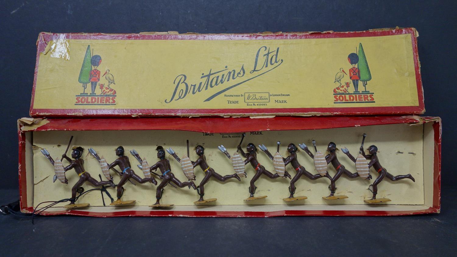 A boxed set of vintage lead figures of Zulu warriors by William Britain