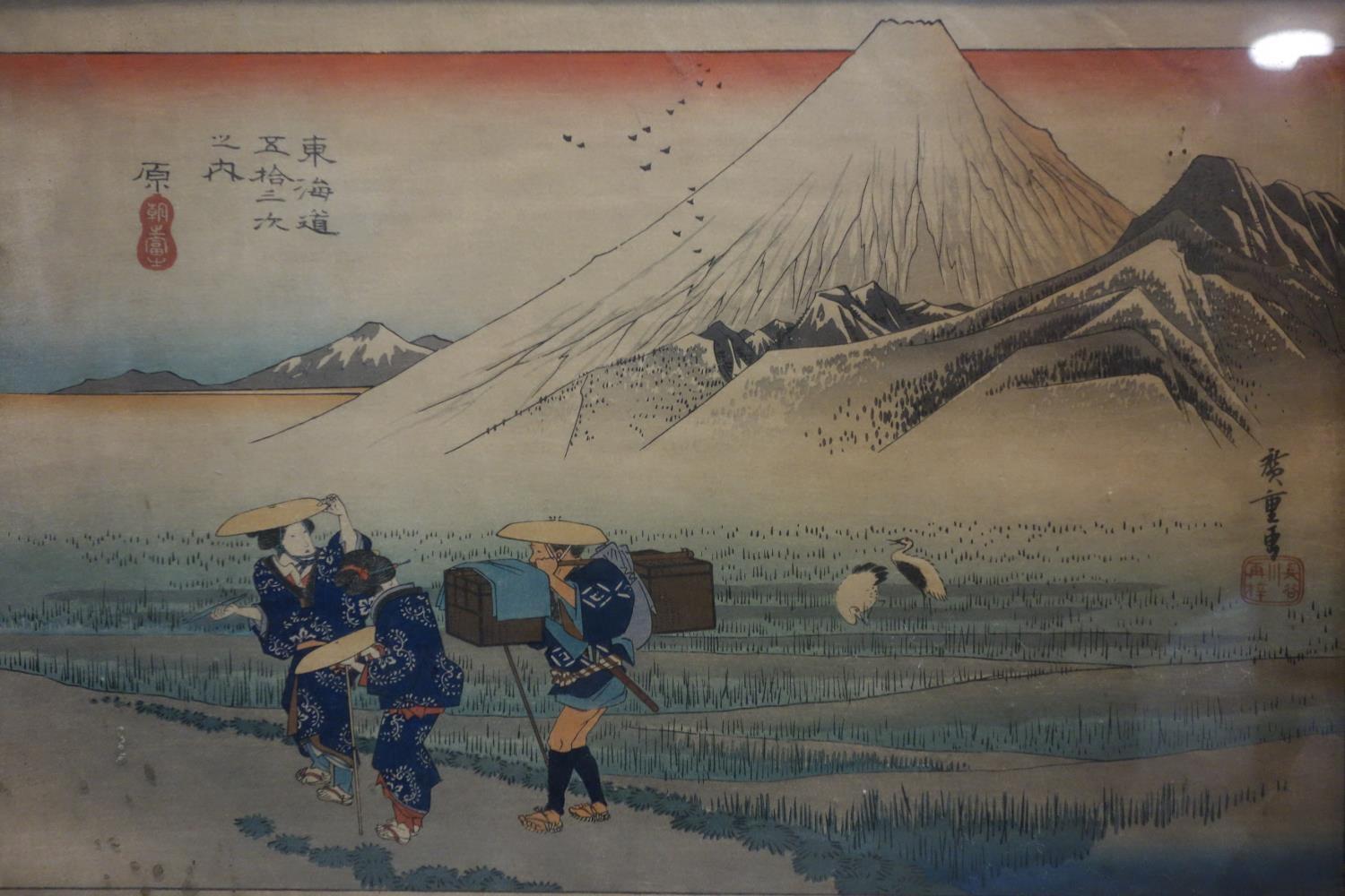 A late 19th/early 20th century Japanese woodblock print, figures by mountains, signed, 25 x 36cm