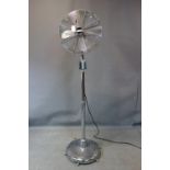 A vintage floor standing industrial fan by Cinni, raised on castors, H.167cm