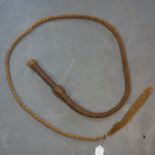 A vintage 8ft brown leather bull whip