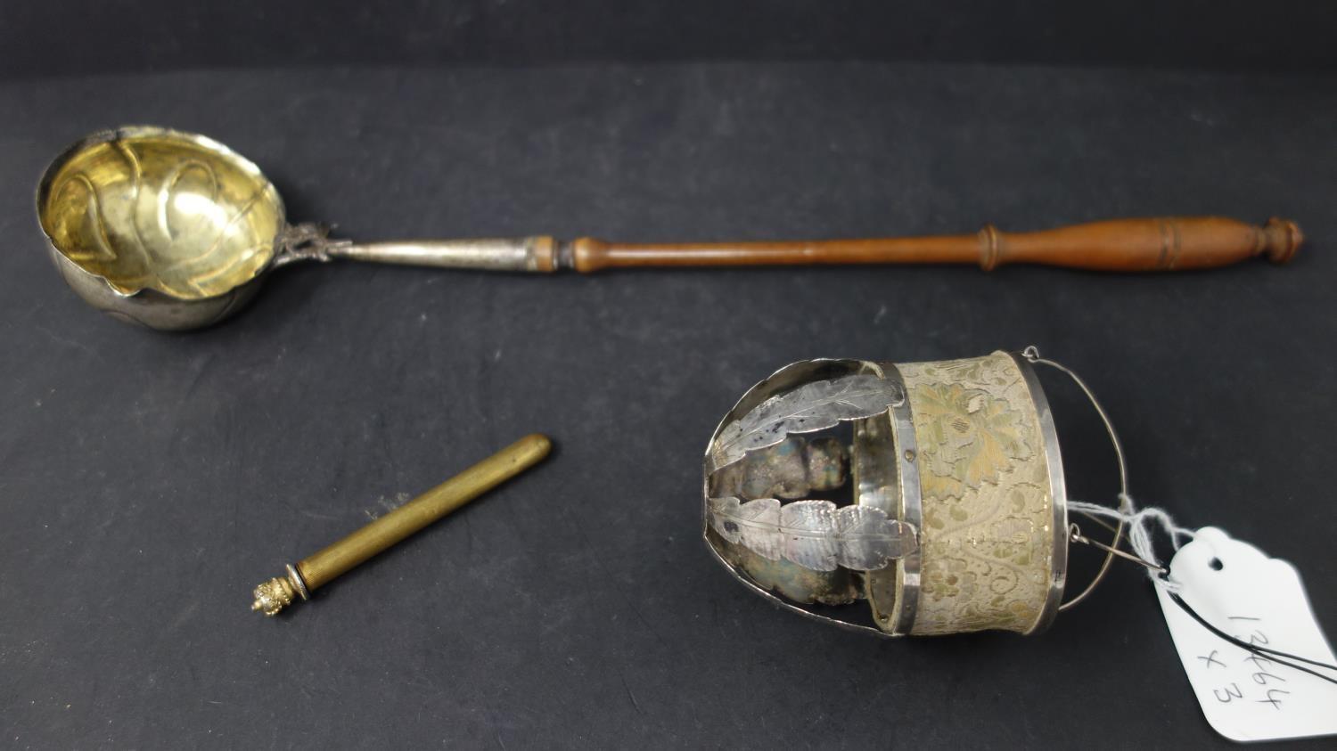 A Danish silver ladle, hallmarked, on turned wooden handle, H.40cm, together with a pierced silver