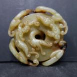 A Chinese jade carving of dragons chasing dragons, D.7cm