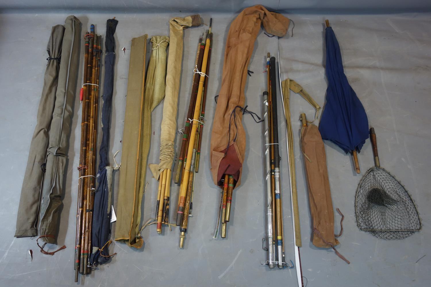 A collection of 10 vintage fishing rods to include 2 split cane and 8 bamboo, together with an