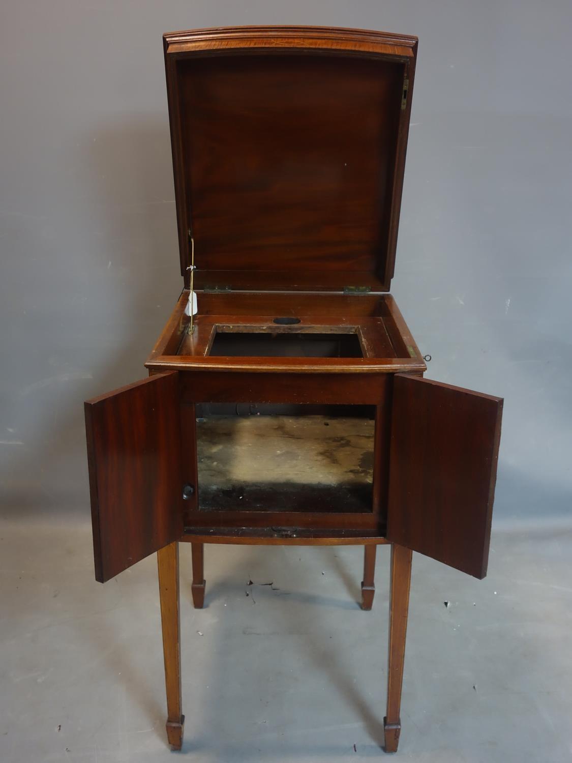 An Edwardian mahogany gramophone cabinet by Aeolian, raised on tapered legs and spade feet, H.91 W.