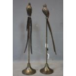 A pair of bronzed birds on stands, H.82cm
