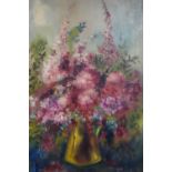 An oil on canvas of a still life of flowers in a jug, framed, 75 x 50cm
