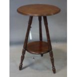 An Arts & Crafts mahogany lamp table