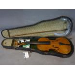 An antique violin with bow, bow is possibly signed but rubbed, in carry case