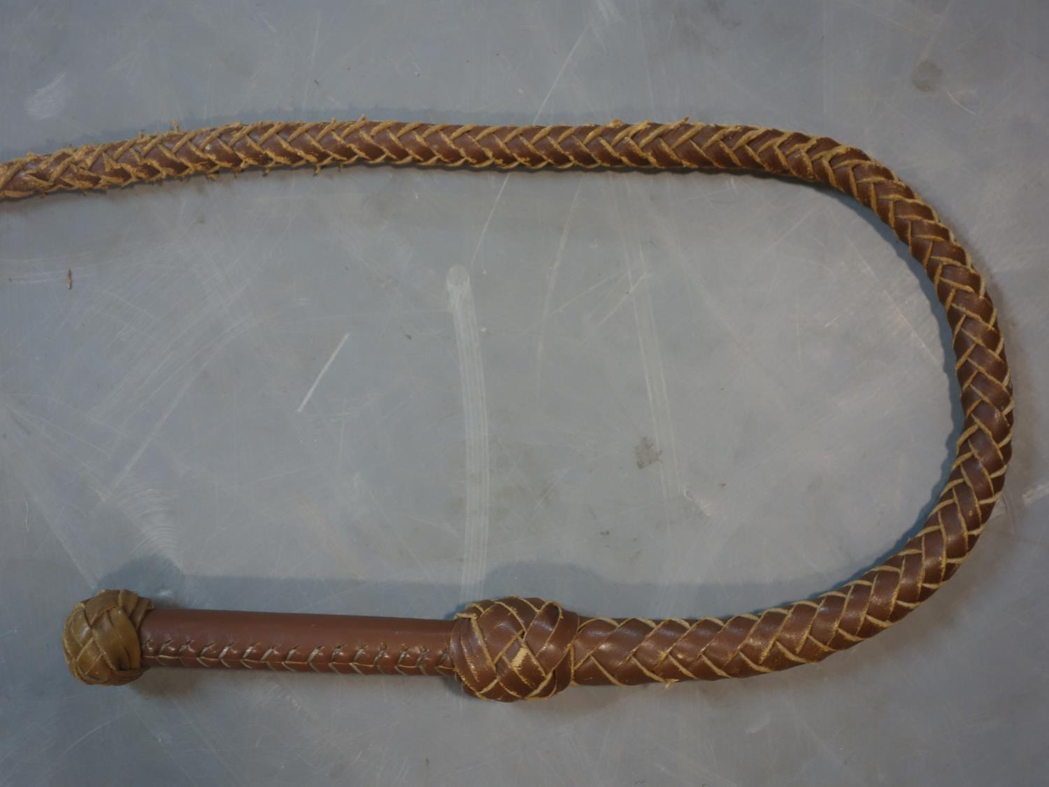 A vintage 8ft brown leather bull whip - Image 2 of 3