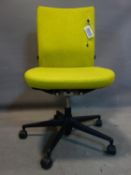 A Vitra swivel office desk chair, with yellow upholstery