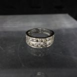 A platinum two row diamond half eternity ring, size O 1/2, with two copies of insurance valuations