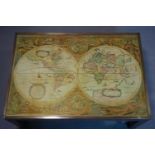 A brass bound mahogany low table, with map of the world to glass top, on square legs with brass caps