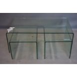 A nest of three glass tables, comprising a low table, H.43 W.109 D.60cm, and two side tables, H.36