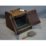 A Victorian mahogany coal scuttle with mechanical pull back handle and shovel