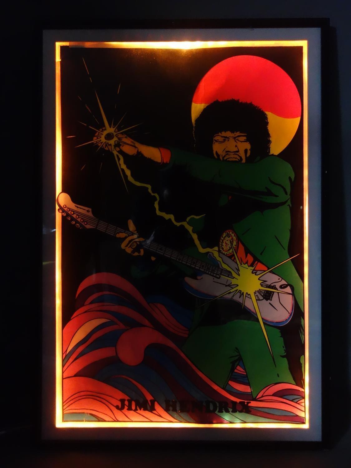 A vintage back lit poster of Jimi Hendrix by Scorpio posters Inc, framed with lighting and