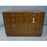 A teak chest of two short over three graduating long drawers, on pedestal base, H.85 W.123 D.56cm