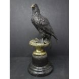 A bronze study of an eagle on a naturalistic base, after A. Thorbum, bearing signature, raised on