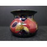 An early Burslem Moorcroft Pomegranate vase, signed William Moorcroft, H.7 D.10cm