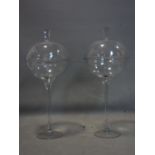 A pair of large glass bon bon dishes and covers, H.74cm