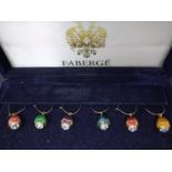 A boxed set of six enamelled Faberge egg earrings, together with a gold plated and silver plated