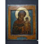 A Russian icon of the Mother of God, tempera on wood panel, inscribed to verso in Cyrillic, 31.5 x