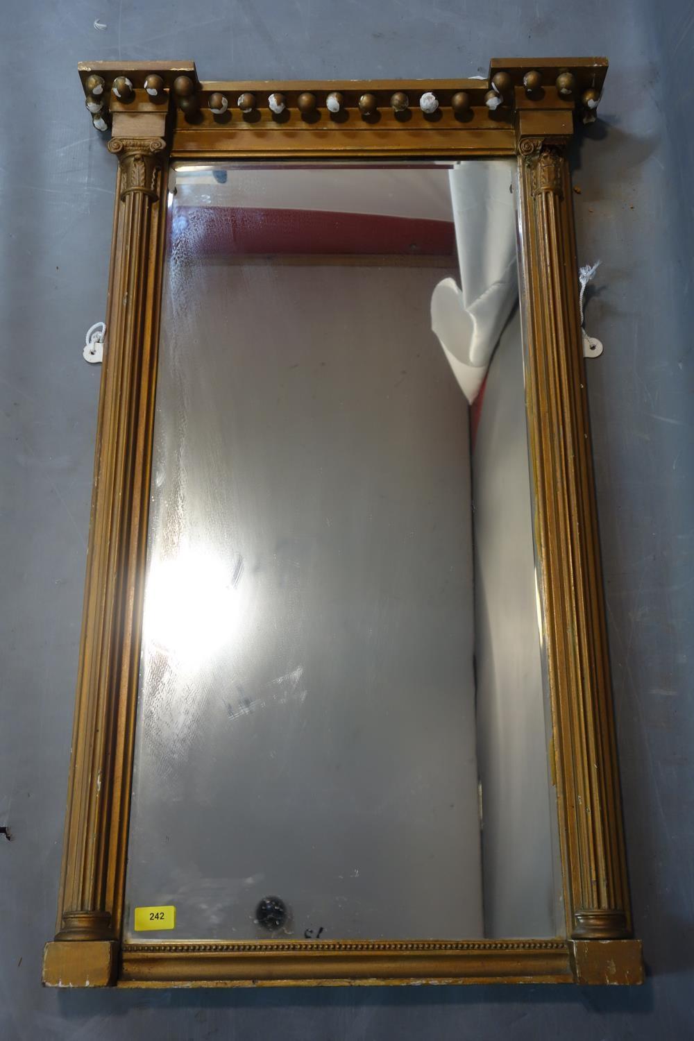 A Regency carved giltwood rectangular pier mirror, with later bevelled glass plate, 104 x 64cm