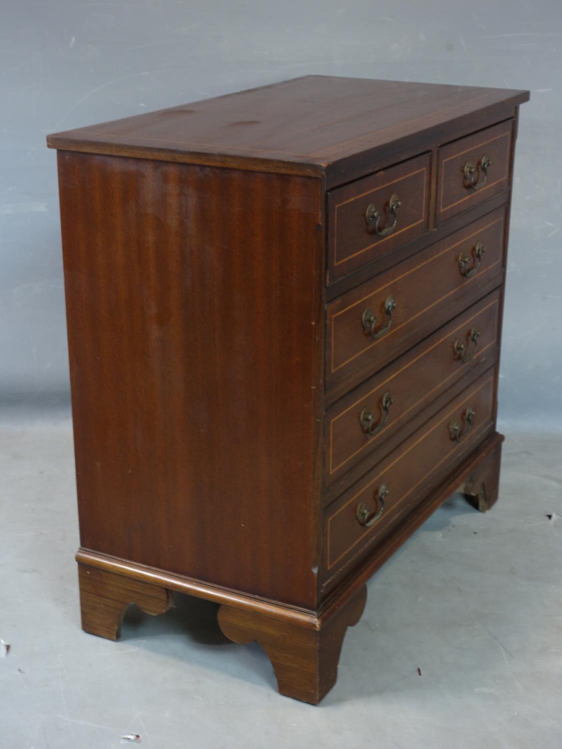 A small inlaid mahogany bachelors chest of two short over three long drawers, raised on bracket - Image 2 of 2