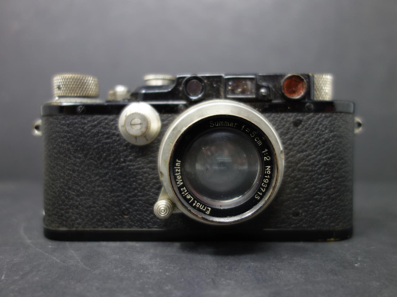 A vintage Leica ernst leitz wetzlar drp no 132212 camera, with original leather case fitted with a