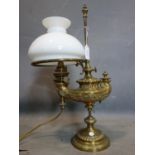 A Victorian brass oil lamp by Wild & Wessel, with opaque glass shade, stamped to base, converted