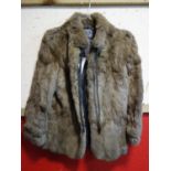 A ladies vintage rabbit fur coat, with label for Dobos Furs, Cardiff