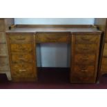 A Victorian burr walnut desk, with brown leather skiver above an arrangement of one long and eight