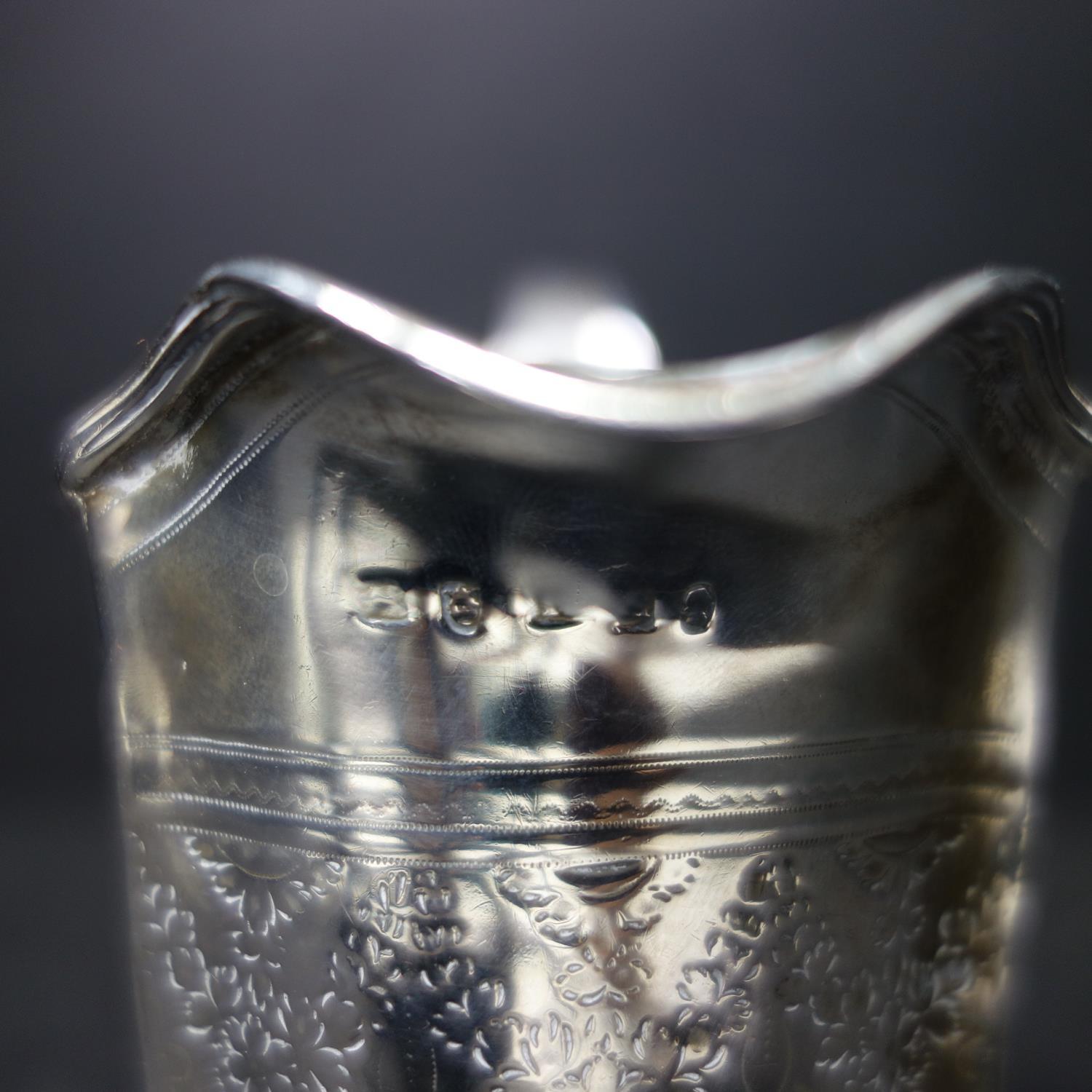 A Georgian silver milk jug, with engraved floral decoration, indistinctly hallmarked, H.10.5cm, - Image 5 of 6