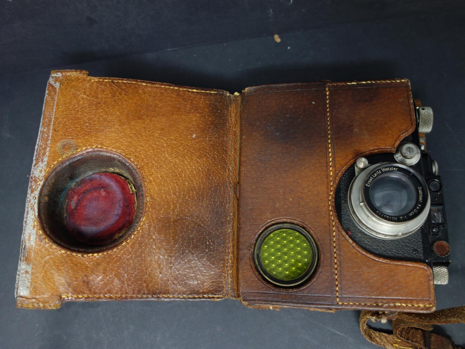A vintage Leica ernst leitz wetzlar drp no 132212 camera, with original leather case fitted with a - Image 4 of 4