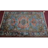 A Northwest Persian Heriz rug, triple pole medallion on a pale ash ground, guarded by a multi