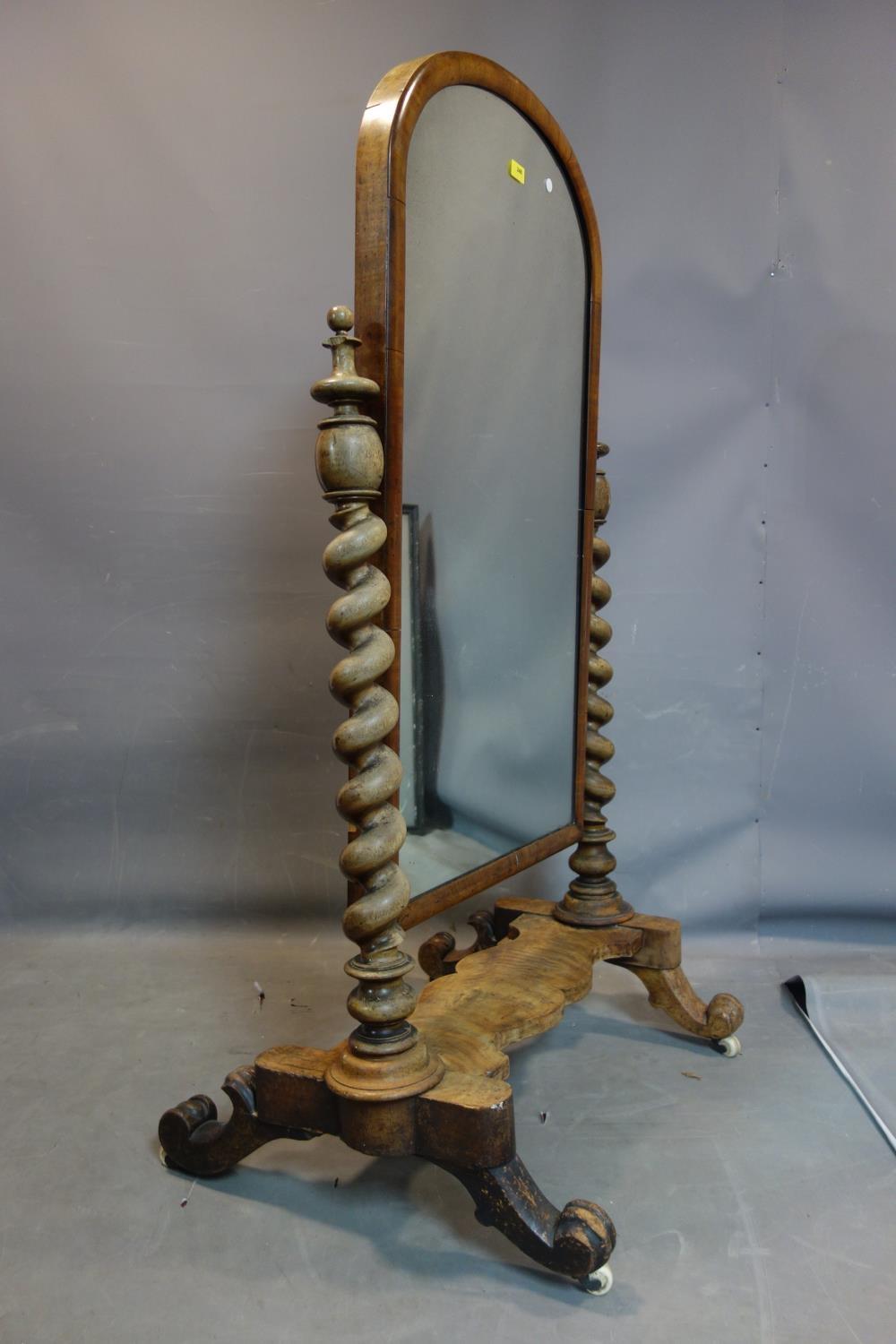 A Victorian mahogany cheval mirror, with barley twist supports, raised on scroll feet and castors, - Image 2 of 2